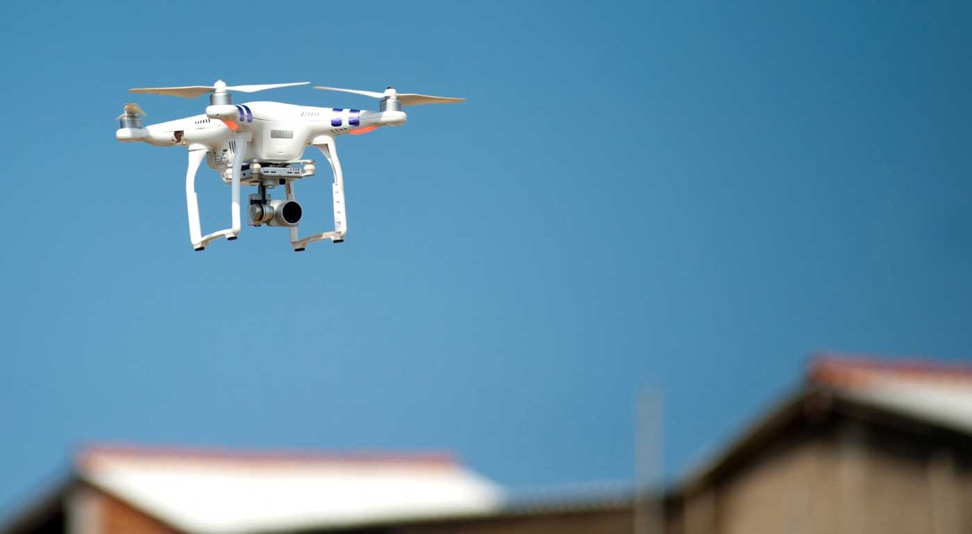 Eberl | Drone flying near a rooftop to perform an insurance roof inspection